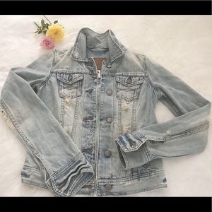 Vintage distressed denim jacket.